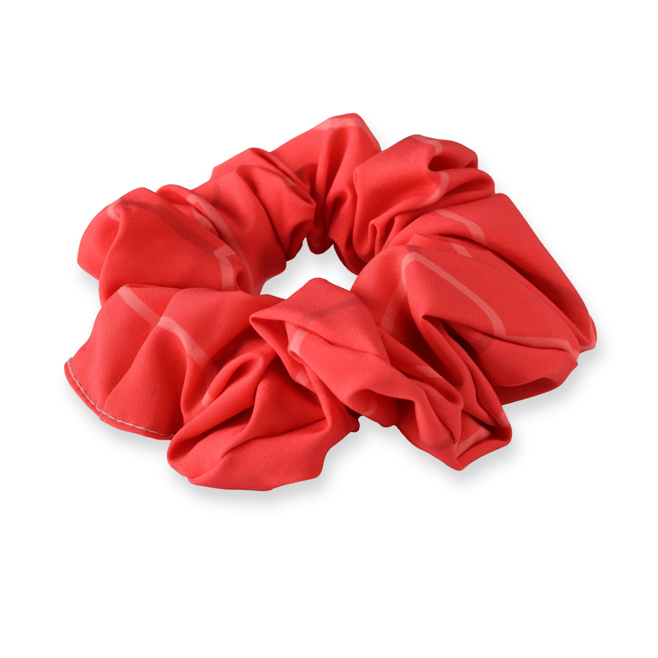 A red scrunchie made of soft material featuring a casual design.